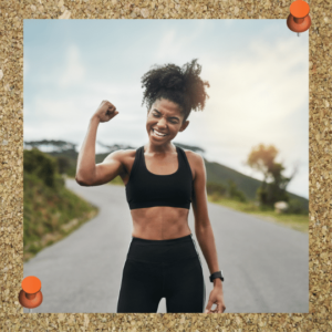 Focus on a growth mindset to battle leadership imposter syndrome. Photo depicts a woman in workout clothing fist pumping her growth.