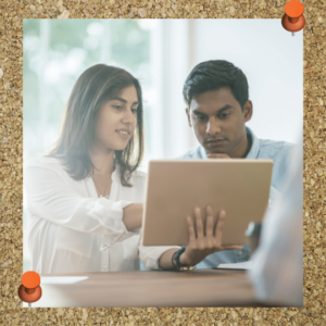 Accepting feedback can help you to grow, thus combating leadership imposter syndrome. The photo depicts a woman sharing feedback with a man. 