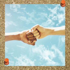 How to motivate employees: Respect them.  The image depicts two hands in a fist bump with a blue, cloudy sky background.