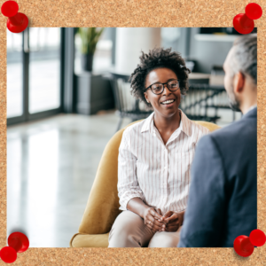 What is a mentor? Photo depicts a professional woman chatting with a professional man.