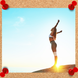 Image depicts female in workout clothing standing in the sunlight with arms outstretched.