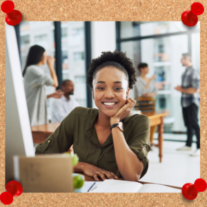 Female employee looks happy to be at work. Her mindset matters.