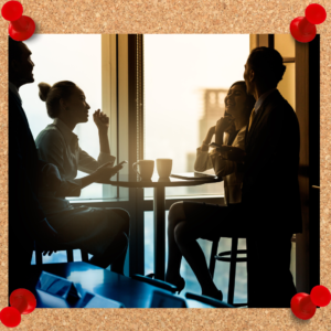 Retention strategies require a lot of planning and effort, as depicted by the group of working people communicating over a table.