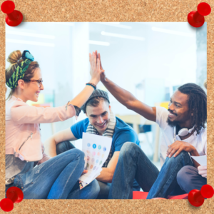 Team creativity is displayed in an image of three team members sitting together as two give a high five.