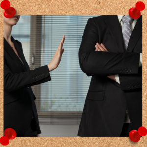 Set leadership boundaries, including ones for personal space, if necessary. The image depicts a business woman holding her hand out in a "stop" motion towards a coworker. 