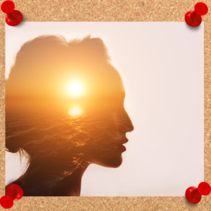 Depicts a silhouette of a woman with an image of a sunset over the ocean inside her head.