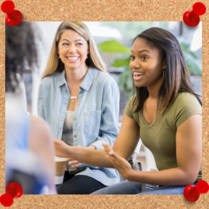 Authenticity in leadership photo depicts females chatting with coffee.