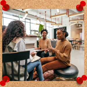 Leadership communication image depicts a group of female employees communicating while seated in a small circle.